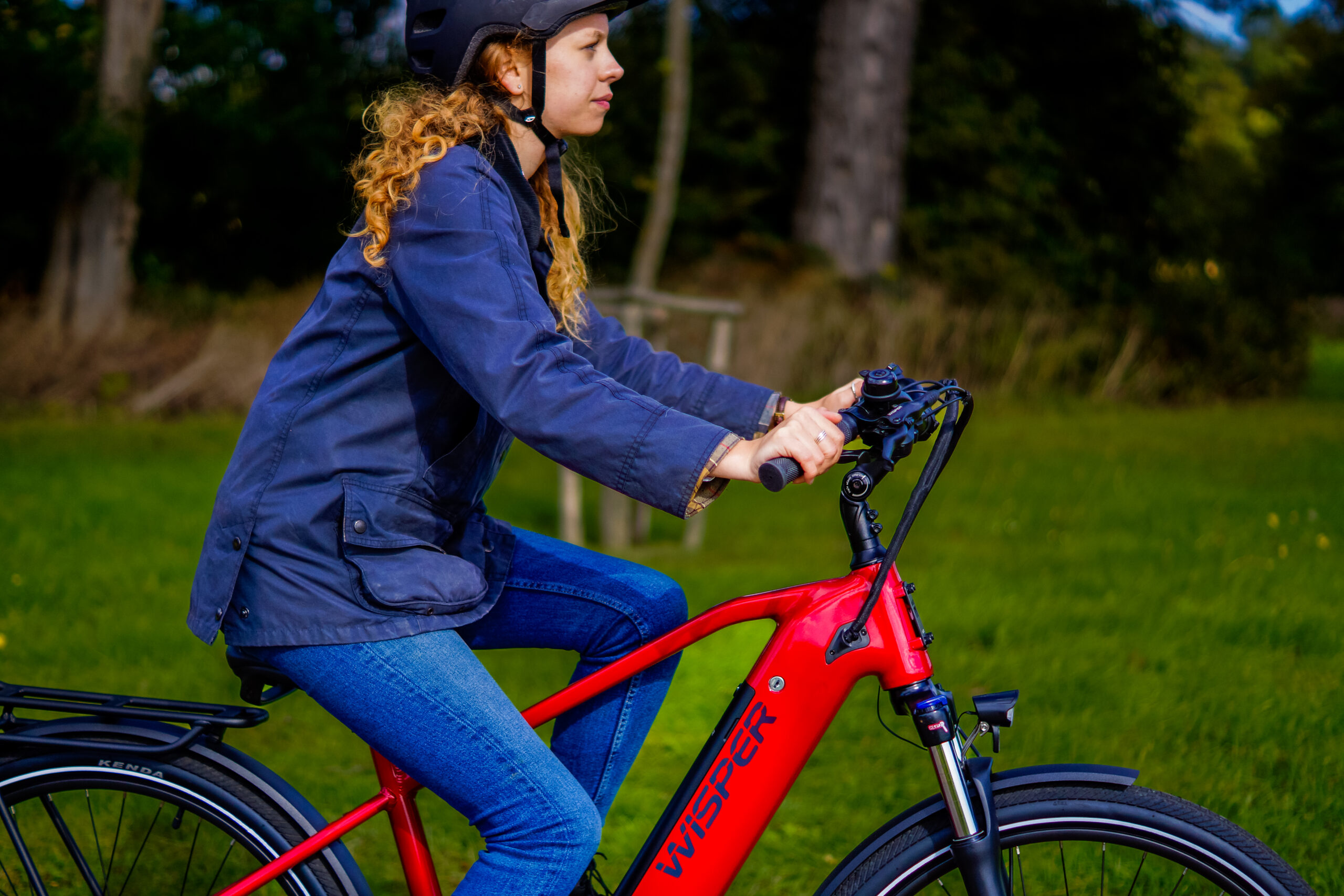 woman riding on a red ebike
