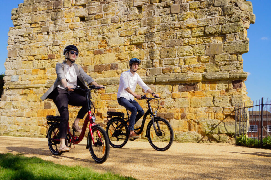 Couple riding on a wisper bike