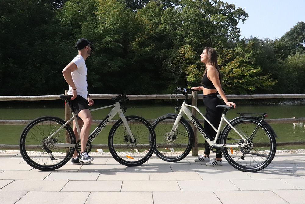 Couple standing by their bikes