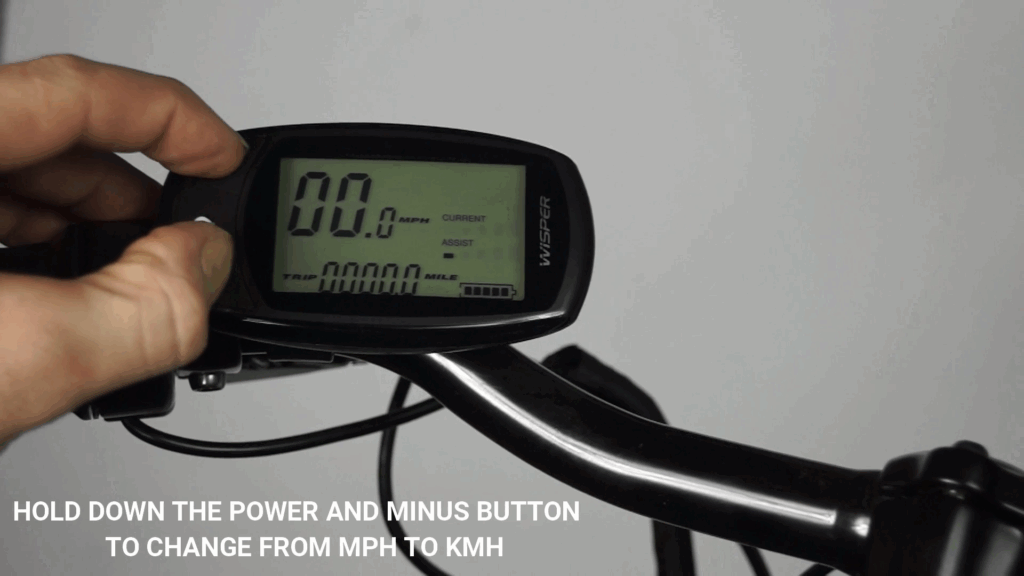 Hold down the power and minus button to change from mph to kmh